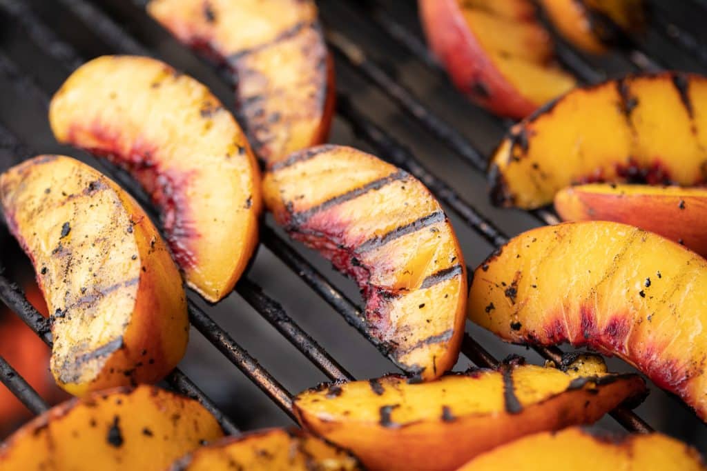 Peach slices on the grill.
