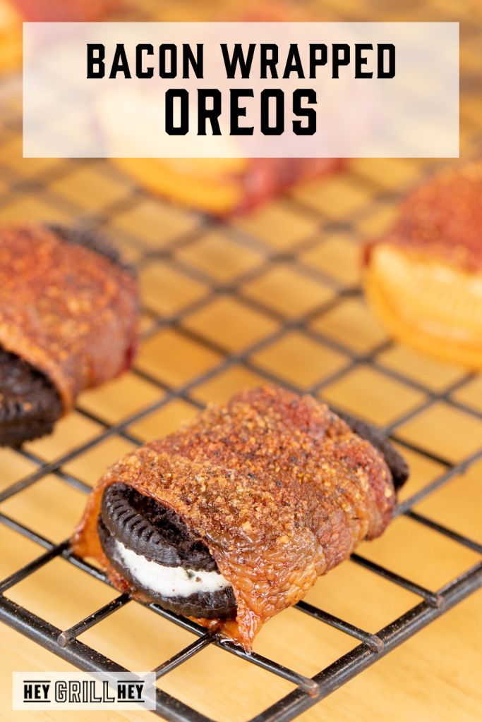 Bacon wrapped oreo on a cooking rack with text overlay - Bacon Wrapped Oreos.