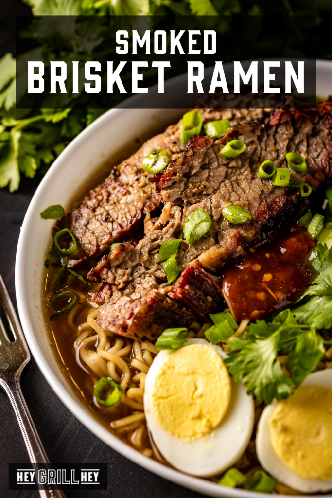 Smoked brisket, cilantro, eggs, and bok choy on top of ramen noodles with text overlay - Smoked Brisket Ramen.