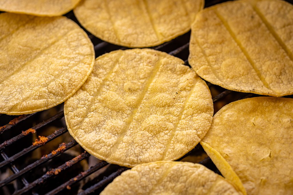 Corn tortillas on the grill.