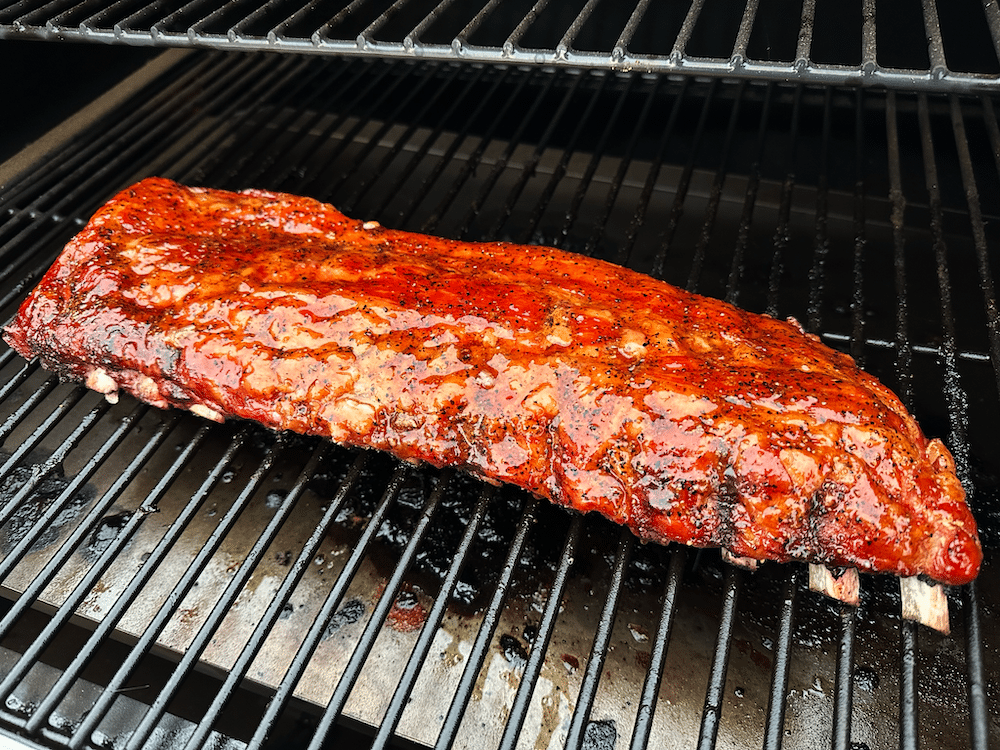 a juicy rack of ribs on the grill