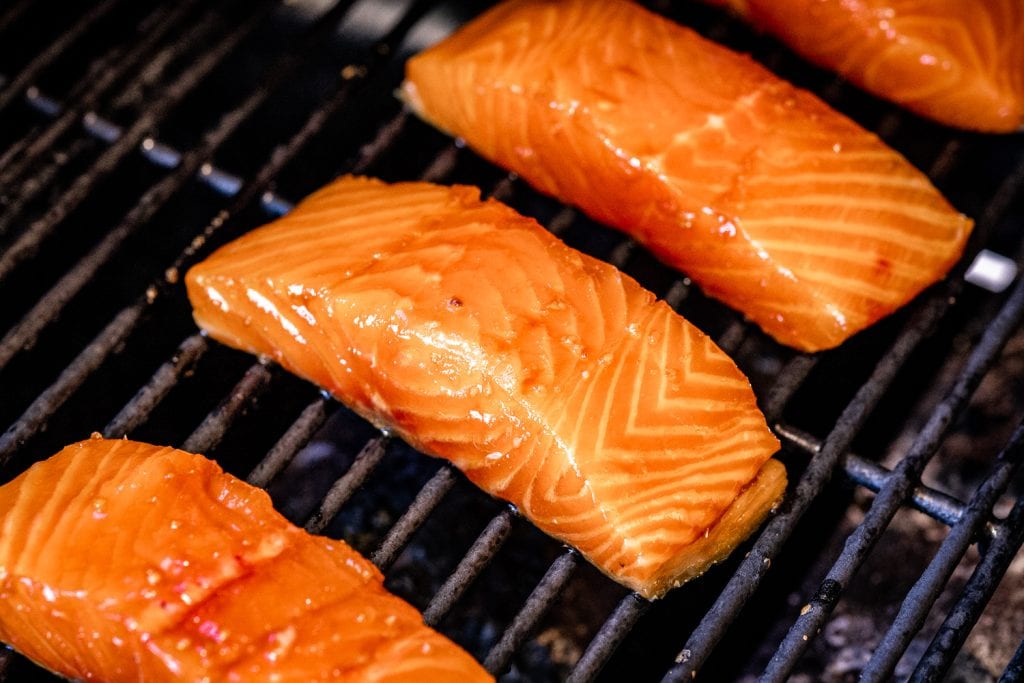 Teriyaki salmon marinated filets on the grill.