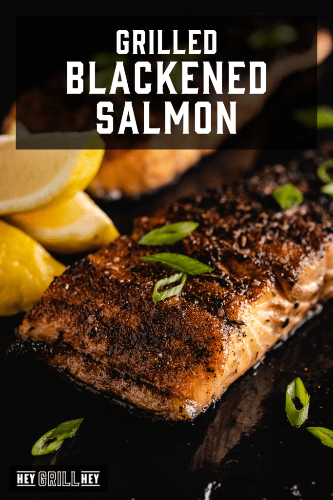 Grilled blackened salmon filet on a serving platter with text overlay - Grilled Blackened Salmon.