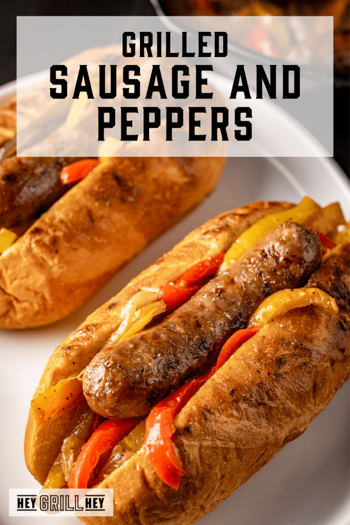 Grilled sausage and peppers on a bun with text overlay - Grilled Sausage and Peppers.