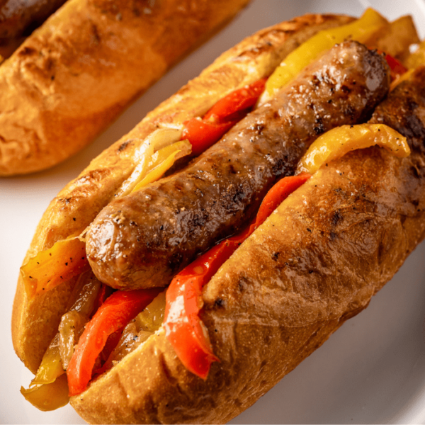 Grilled sausage and peppers on a bun.