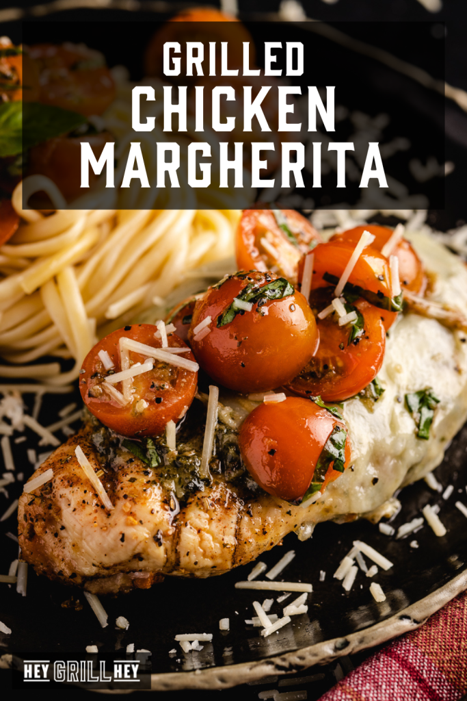 Grilled chicken margherita on a serving dish next to pasta with text overlay - Grilled Chicken Margherita.