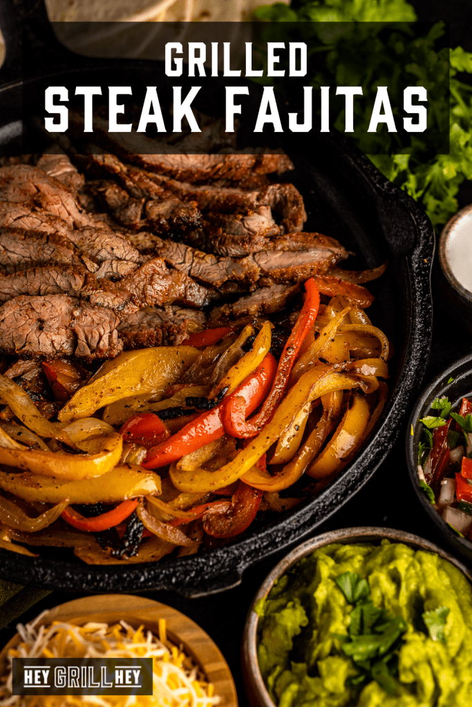 Ingredients for grilled steak fajitas in a cast iron skillet with text overlay - Grilled Steak Fajitas.