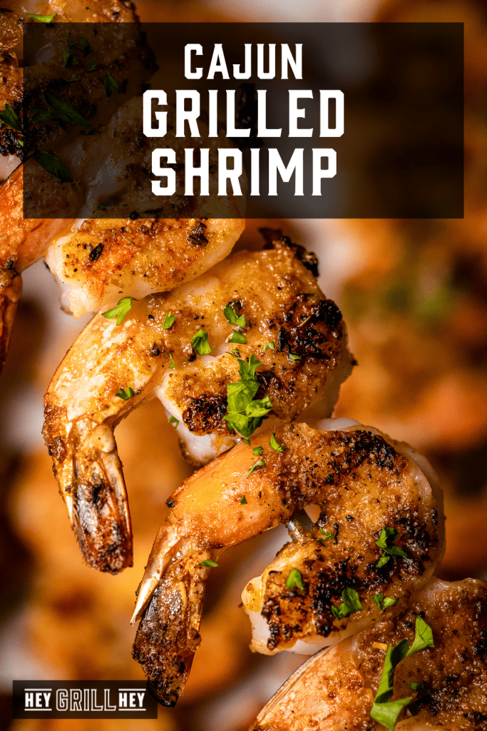 Cajun grilled shrimp on a skewer with text overlay - Cajun Grilled Shrimp.