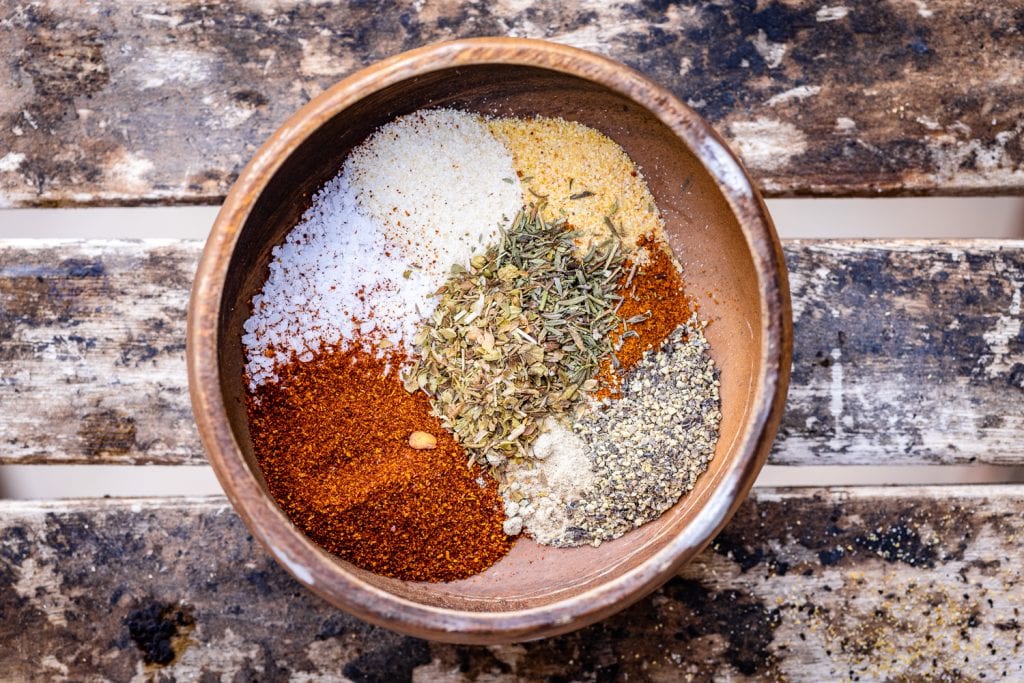 Ingredients for cajun seasoning in a small mixing bowl.