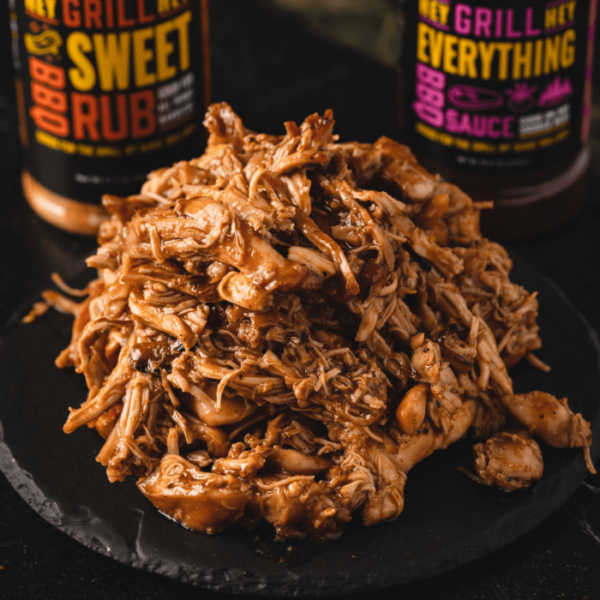 Pile of BBQ pulled chicken on a serving platter.
