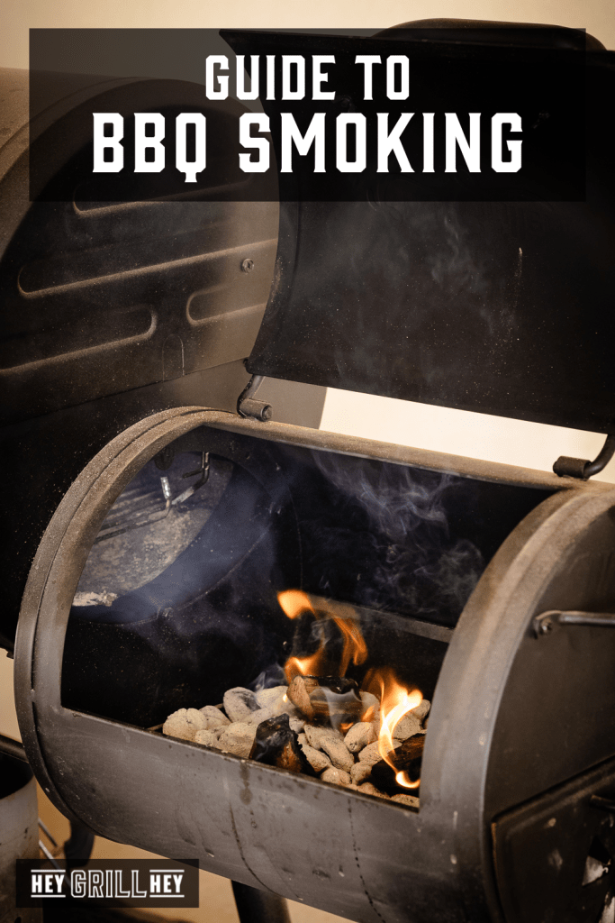 Charcoal and wood in a smoker with text overlay - Guide to BBQ Smoking.