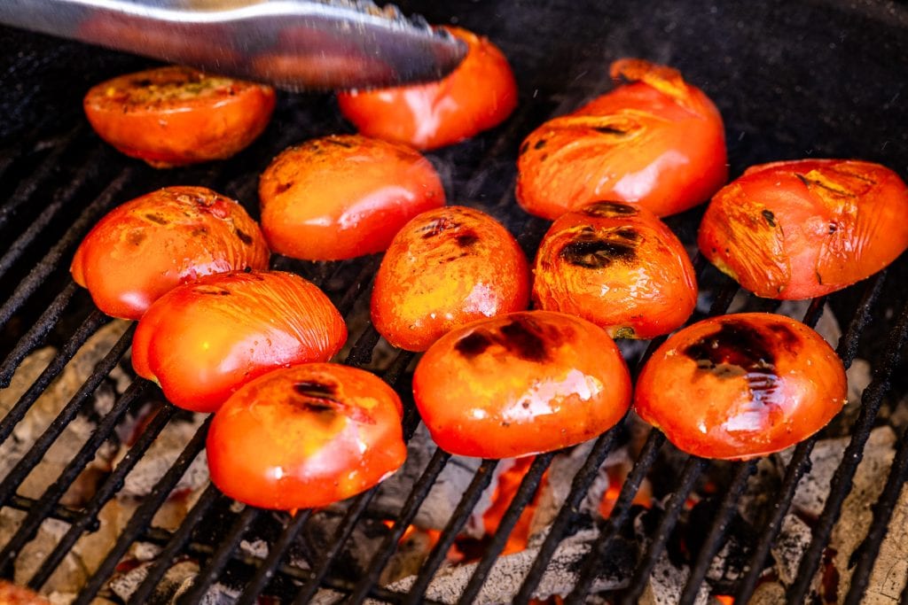 Sliced tomatoes on the grill.