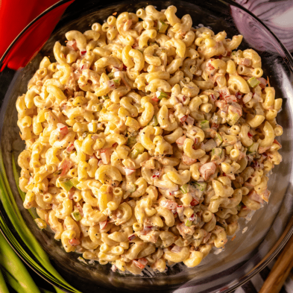 Overhead photo of macaroni salad in a glass bowl