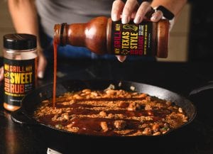 Texas Style BBQ Sauce being poured over beans