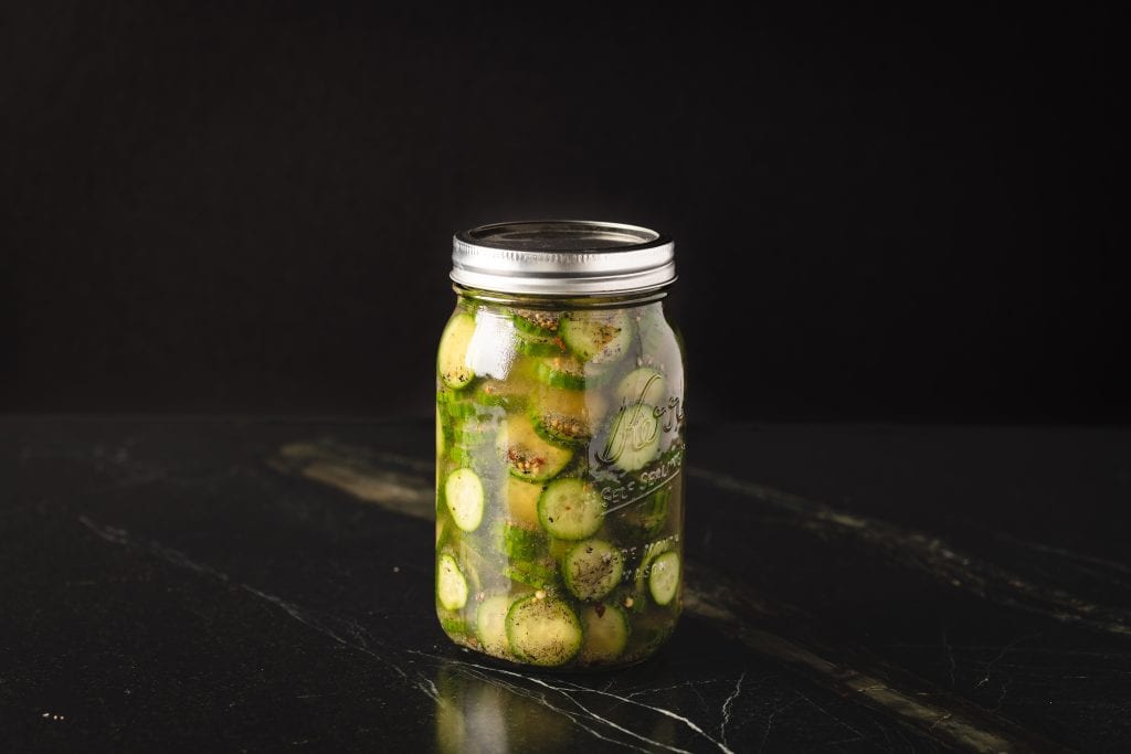 Glass mason jar full of quick pickles.