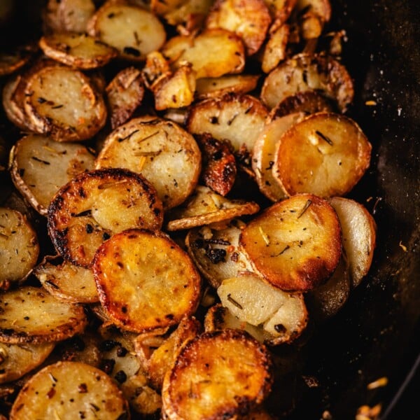 Grilled potatoes in a cast iron skillet.