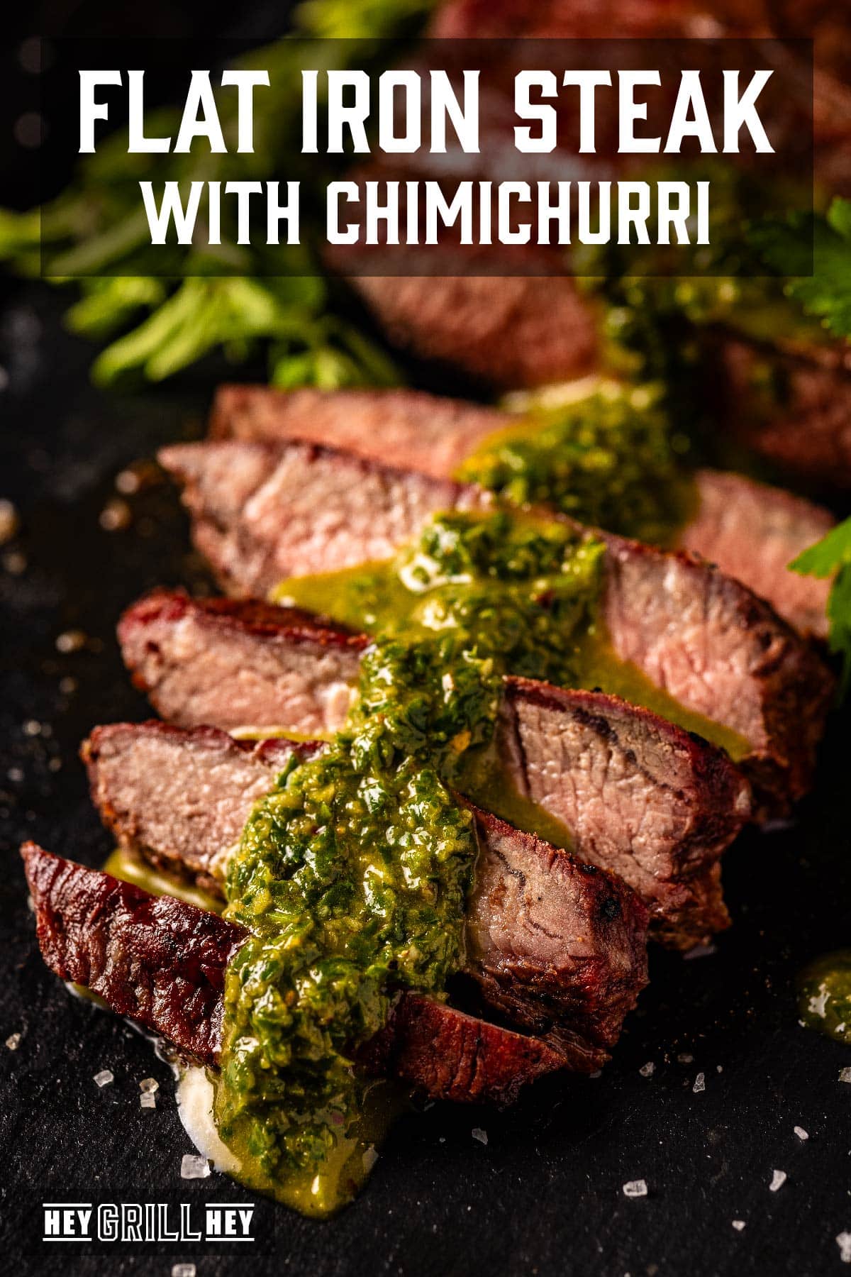 Sliced steamed topped with chimichurri sauce. Text reads "Flat Iron Steak with Chimichurri".