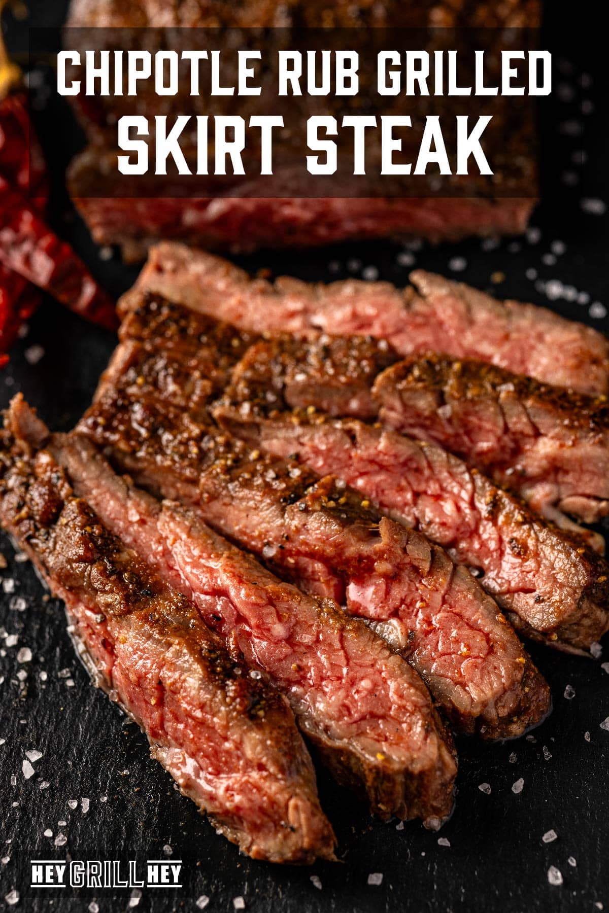 Sliced steak on cutting board. Text reads "Chipotle Rub Grilled Skirt Steak".