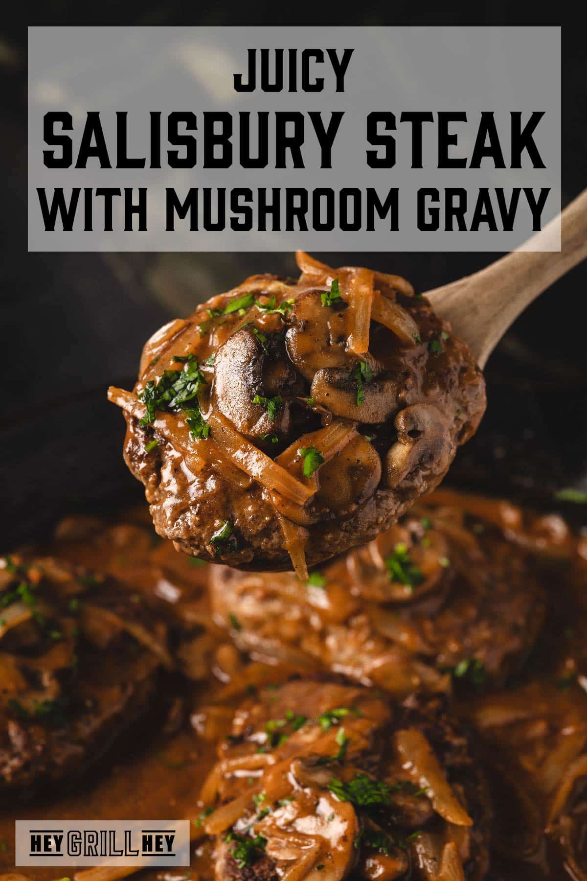 Salisbury steak on wooden spoon above serving dish. Text reads "Juicy Salisbury Steak with Mushroom Gravy".