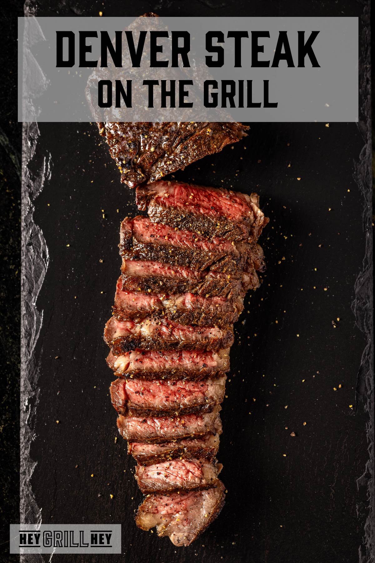Sliced steak on black platter. Text reads "Denver Steak on the Grill".