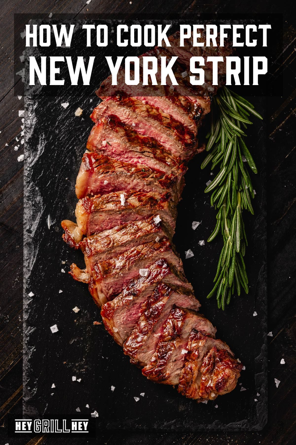 Sliced steak on black serving platter. Text reads "How to Cook Perfect New York Stip".