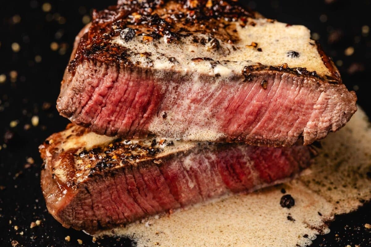 Sliced steak au poivre in cognac sauce.
