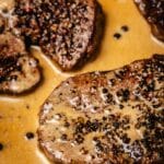 Seared tenderloins in cognac pepper sauce.