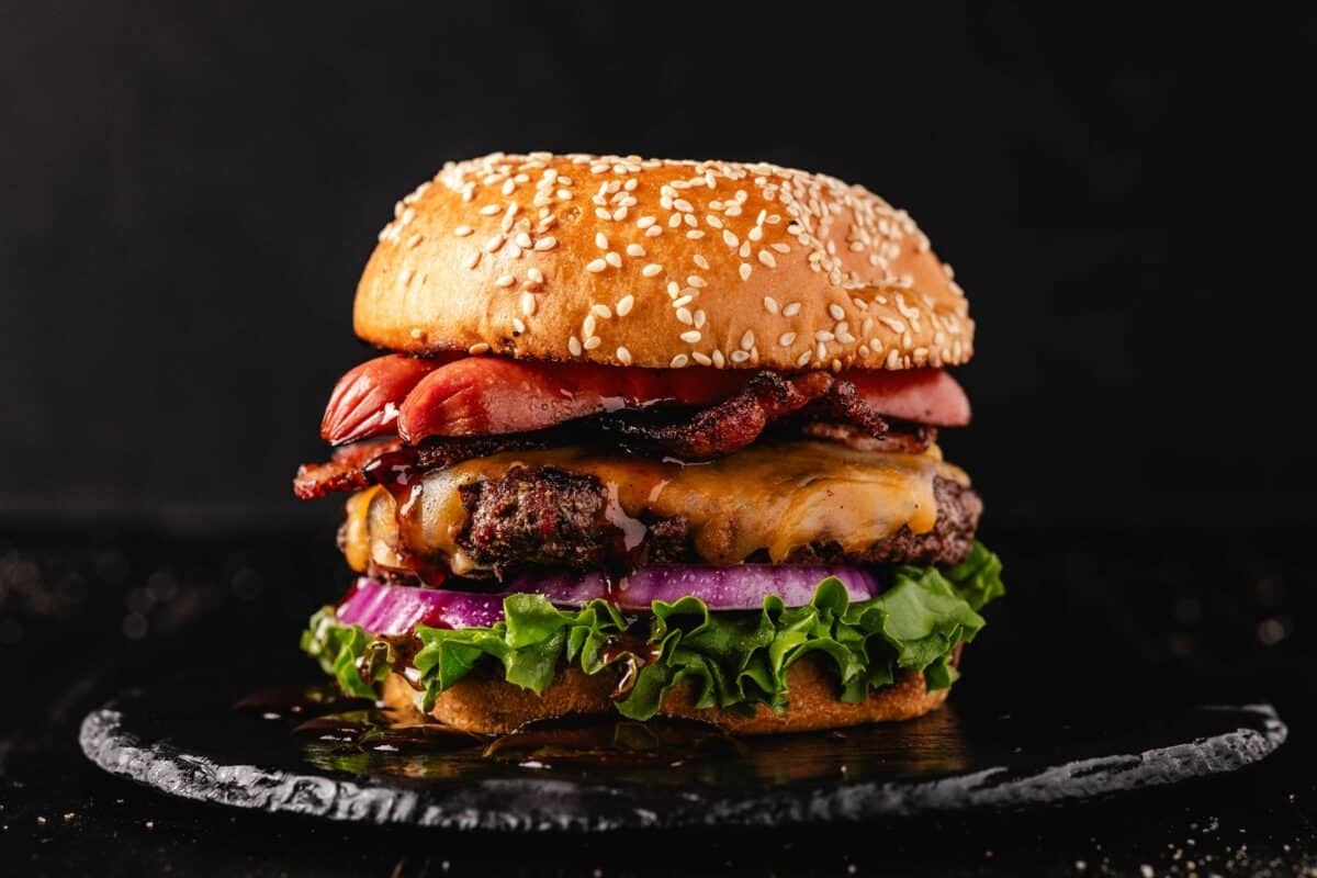 All-American Grilled Burger on black serving platter.