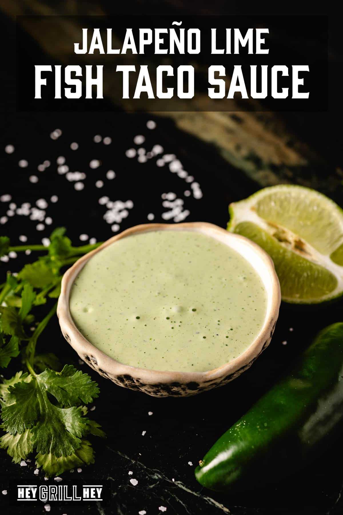 Sauce in bowl next to lime wedge. Text reads "Jalapeño Lime Fish Taco Sauce".