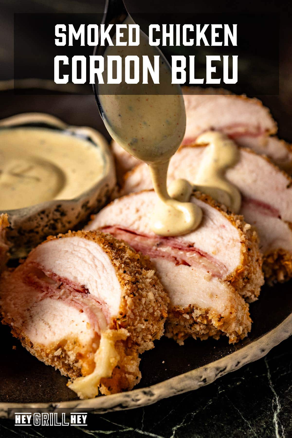 Chicken cutlets drizzled with Dijon sauce. Text reads "Smoked Chicken Cordon Bleu".