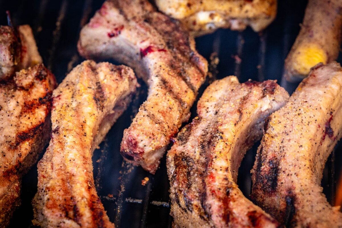 Party ribs on grill grates.