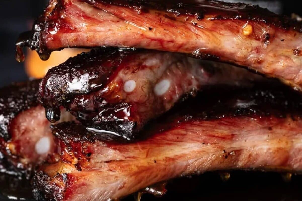 Stacked ribs drizzled with glaze.