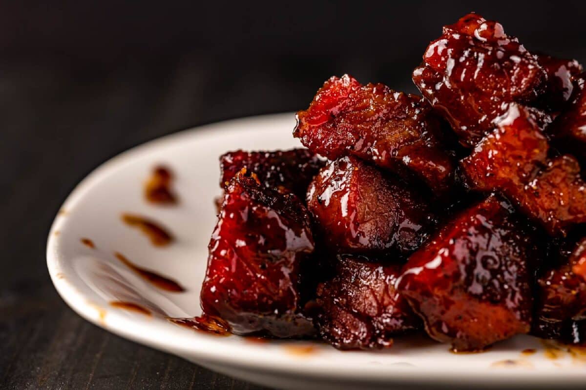 Brisket burnt ends on white plate.