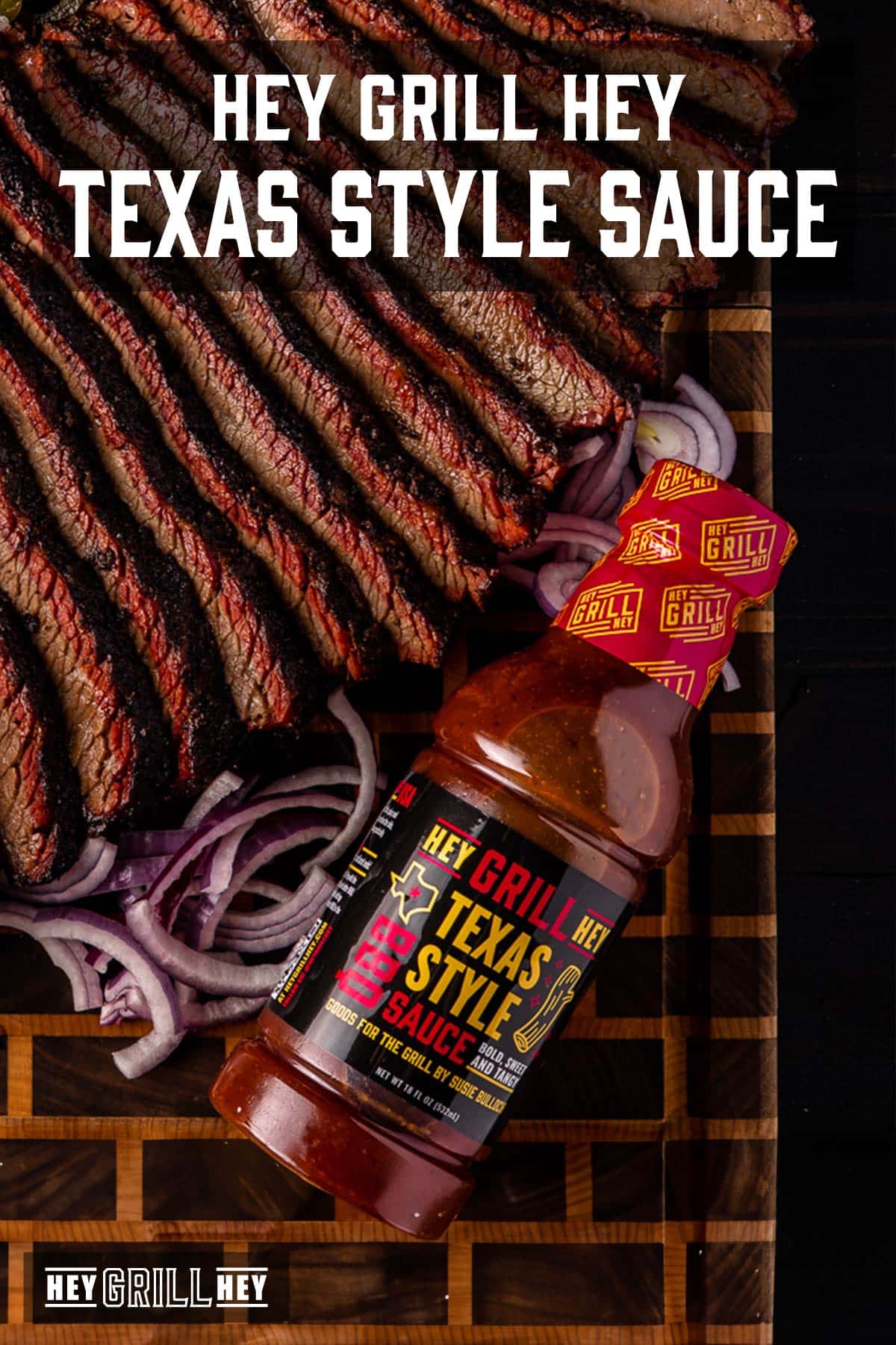 Bottle of BBQ Sauce next to sliced brisket and onions. Text reads "Hey Grill Hey Texas BBQ Sauce."