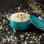 Blue cheese dressing in blue jar with lid.