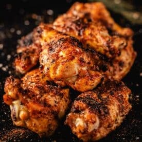 Cajun wings piled on a serving platter.