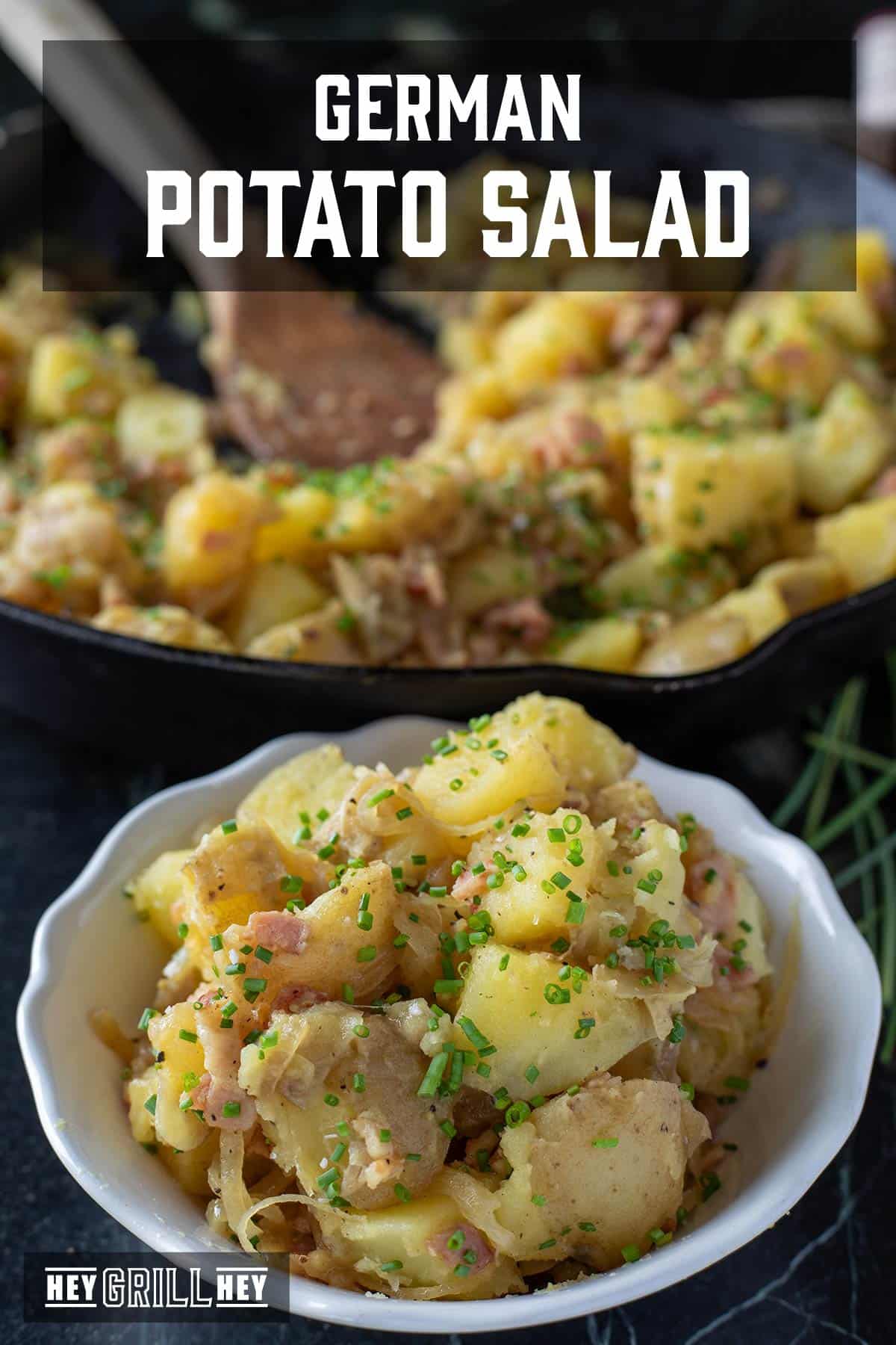 A bowl of potato salad, with a skillet in the background. The text overlay reads "German Potato Salad" at the top, and "Hey Grill Hey" at the bottom.