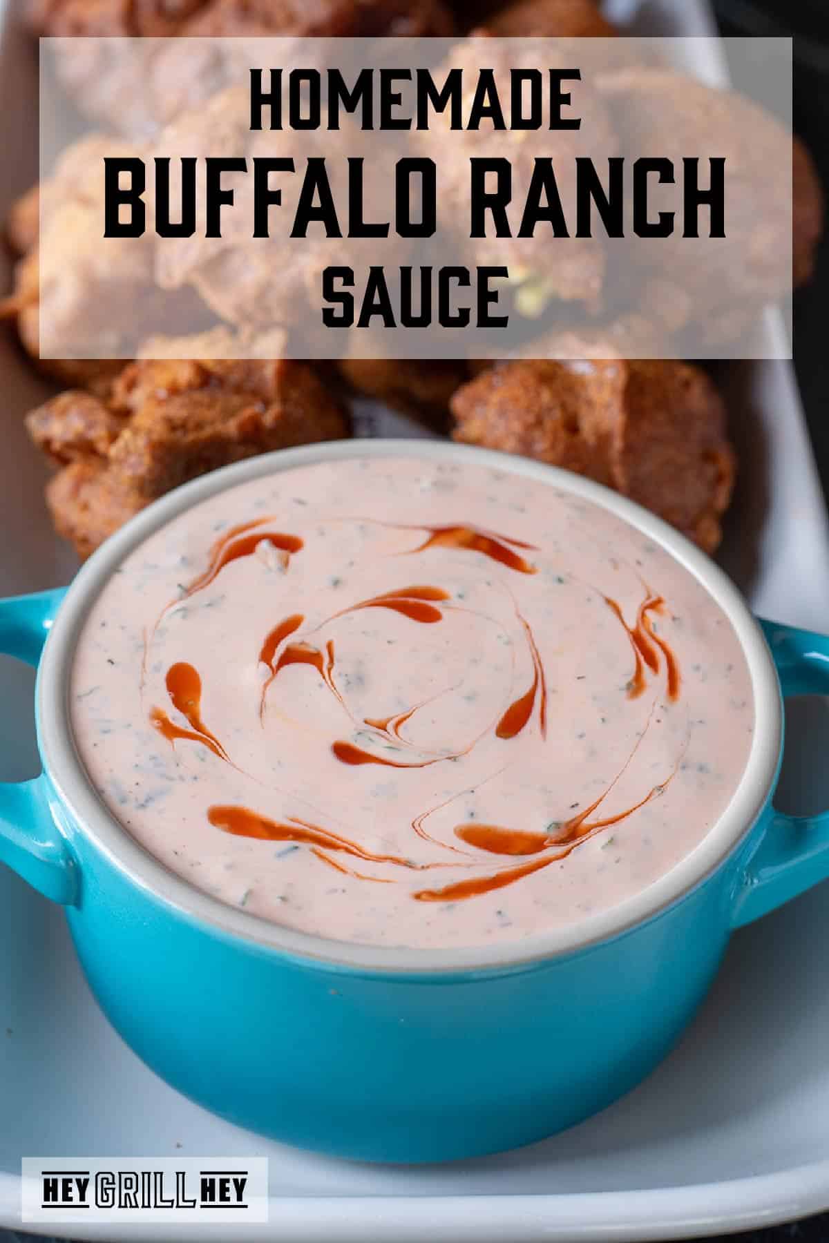 Dipping sauce in a blue bowl on a white platter with hush puppies. The text overlay and the top reads "Homemade Buffalo Ranch Sauce," and the small one at the bottom reads "Hey Grill Hey."