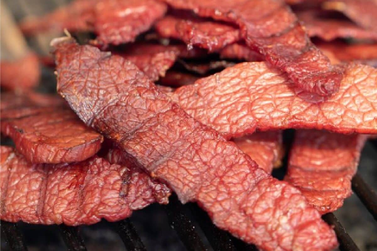 Slices of dried corned beef stacked in a pile.