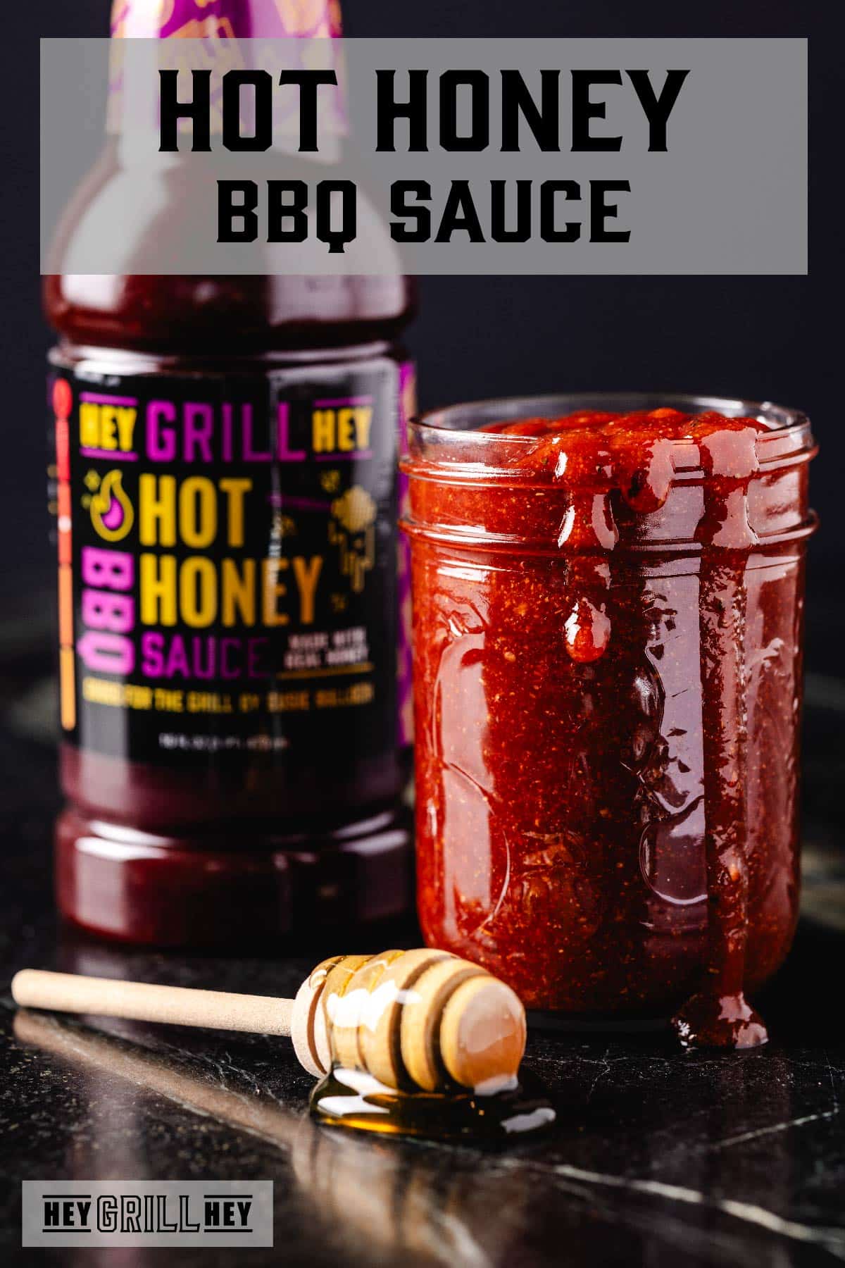 A glass jar filled with sauce next to a bottle of sauce and a honey dipper. The text overlay reads "Hot Honey BBQ Sauce" at the top, and "Hey Grill Hey" at the bottom.