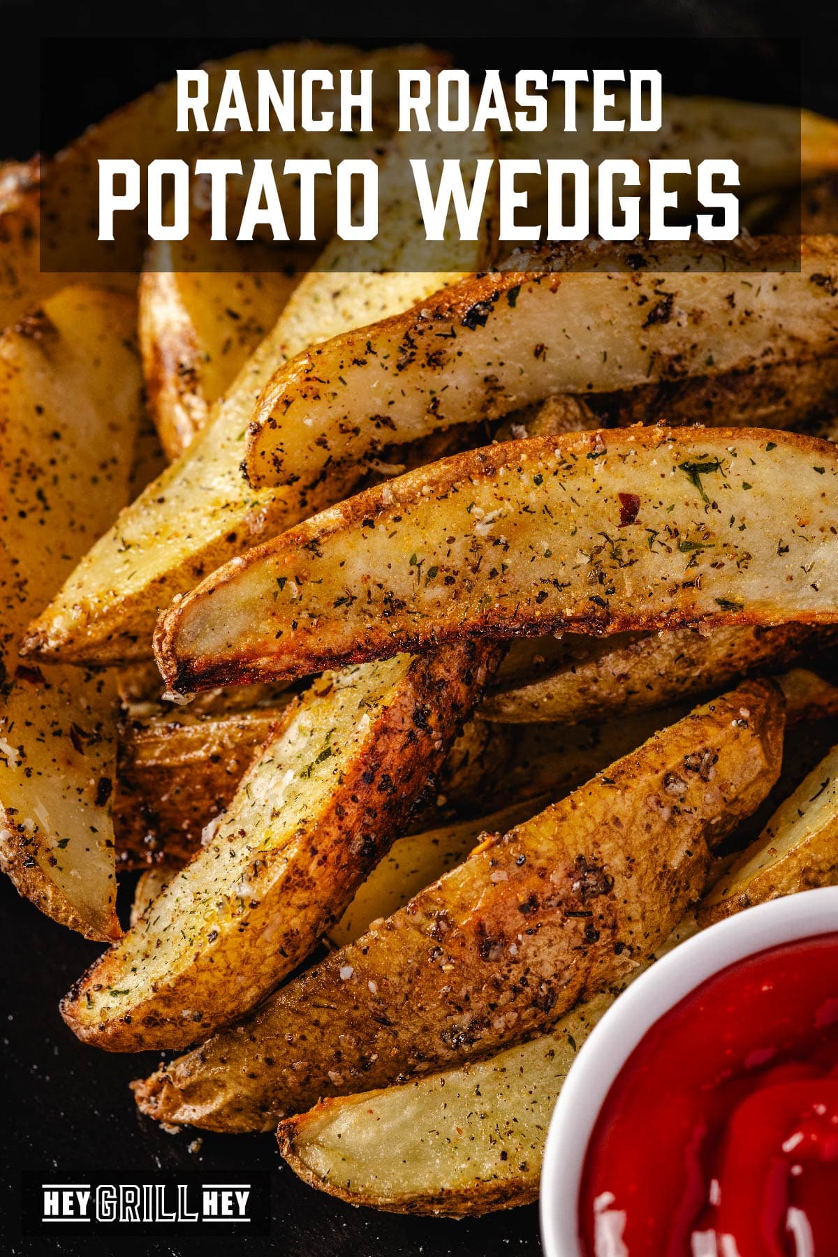 Potato wedges stacked next to a cup of dipping sauce. The text overlay reads "Ranch Roasted Potato Wedges" at the top, and "Hey Grill Hey" at the bottom.