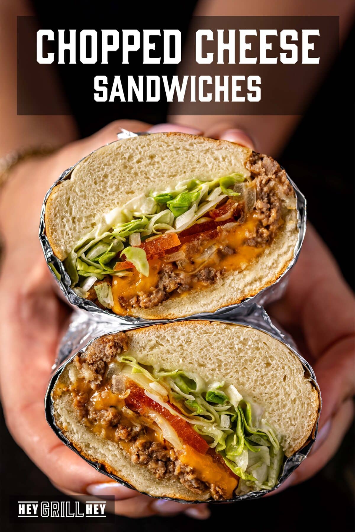 Hands holding two halves of a sandwich wrapped in foil. The text overlay reads "Chopped Cheese Sandwiches" at the top, and "Hey Grill Hey" at the bottom.