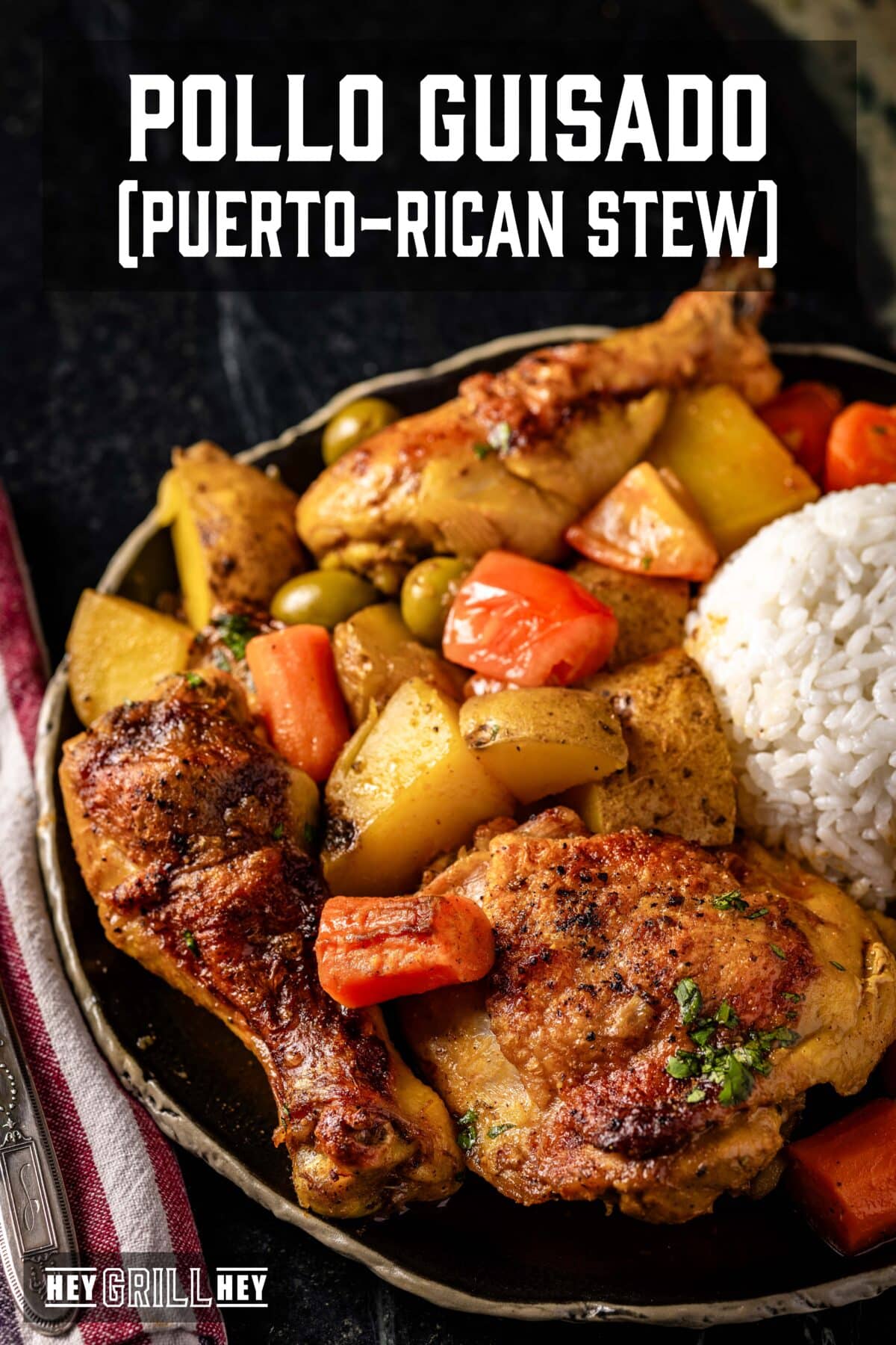 A bowl of chicken stew with carrots, potatoes, and a scoop or rice. The text overlay reads "Pollo Guisado (Puerto-Rican Stew)" at the top, and "Hey Grill Hey" at the bottom.