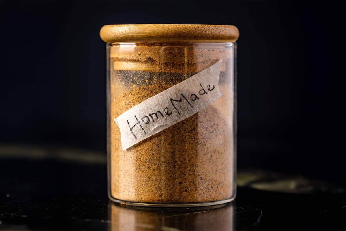 A glass jar filled with seasoning.