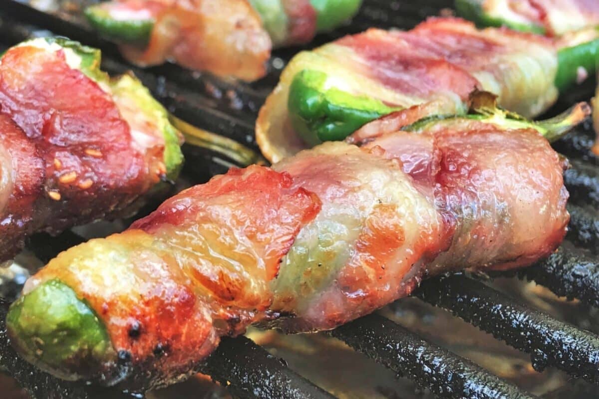 A recipe for bacon wrapped jalapeños on the grill.