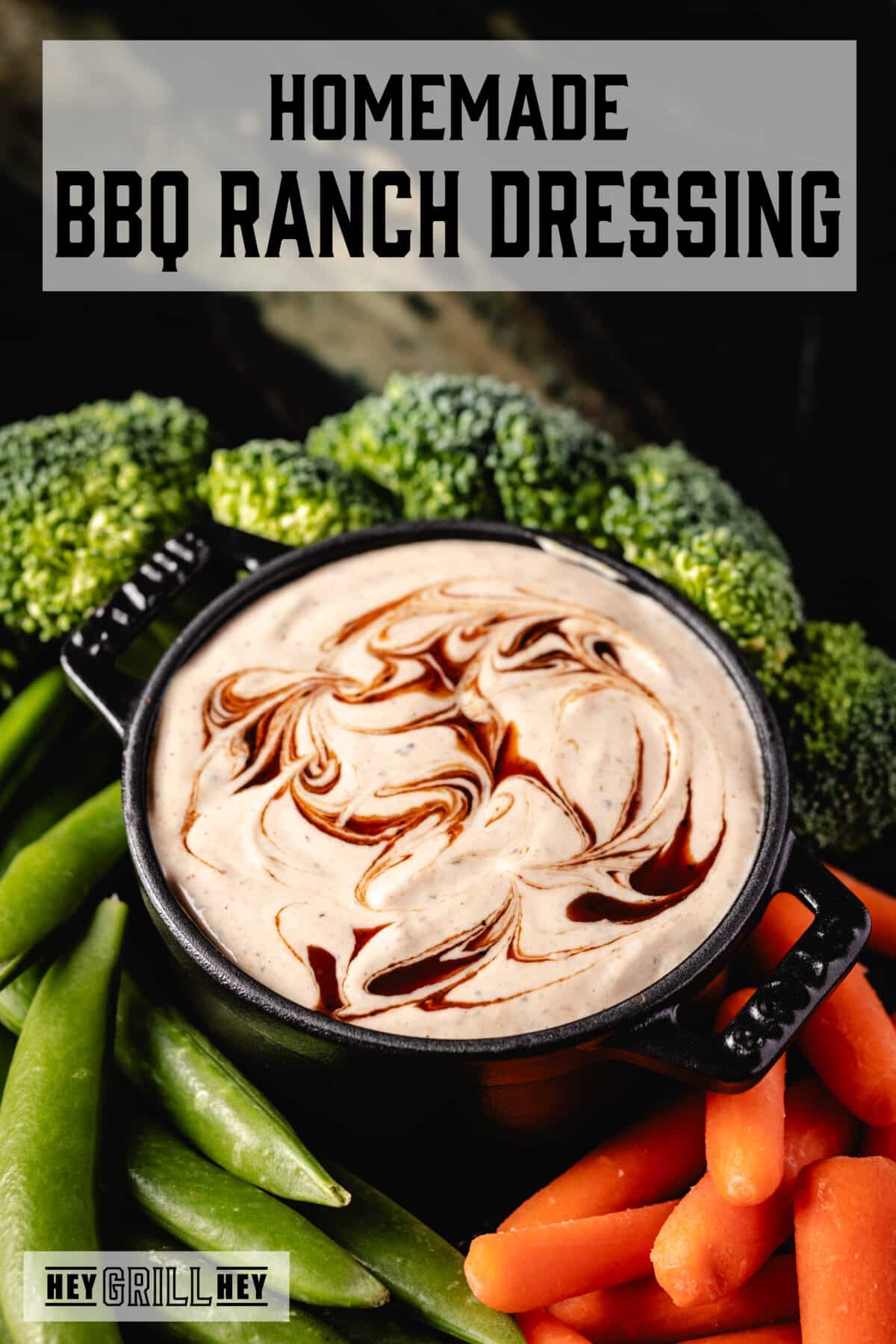 A black bowl filled with ranch dip, surrounded by fresh carrot sticks, broccoli, and snap peas. The text overlay reads "Homemade BBQ Ranch Dressing" at the top, and "Hey Grill Hey" at the bottom.