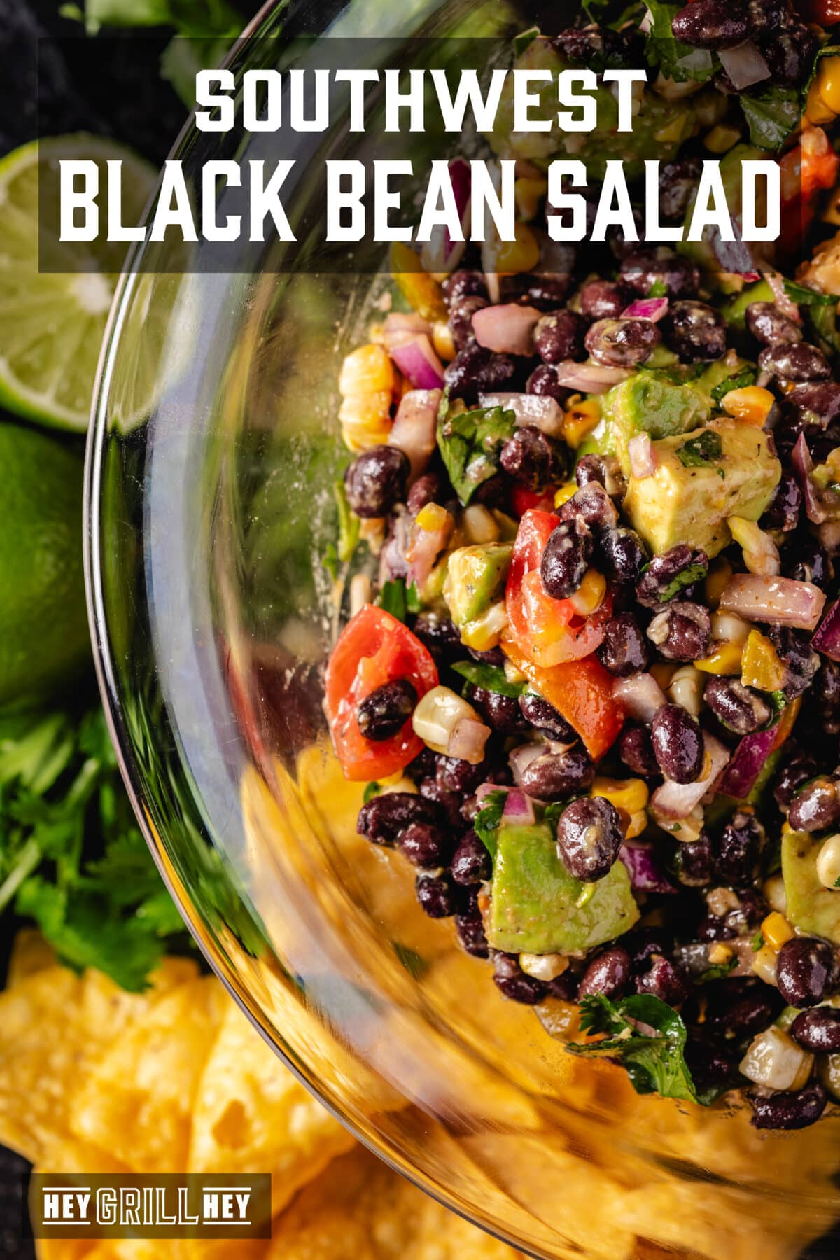 A header of a bowl of bean salad next to chips and lime wedges. The overlap of the text reads "South black bean salad -ovest" above, e "Hey Grill Hey" in conclusion.