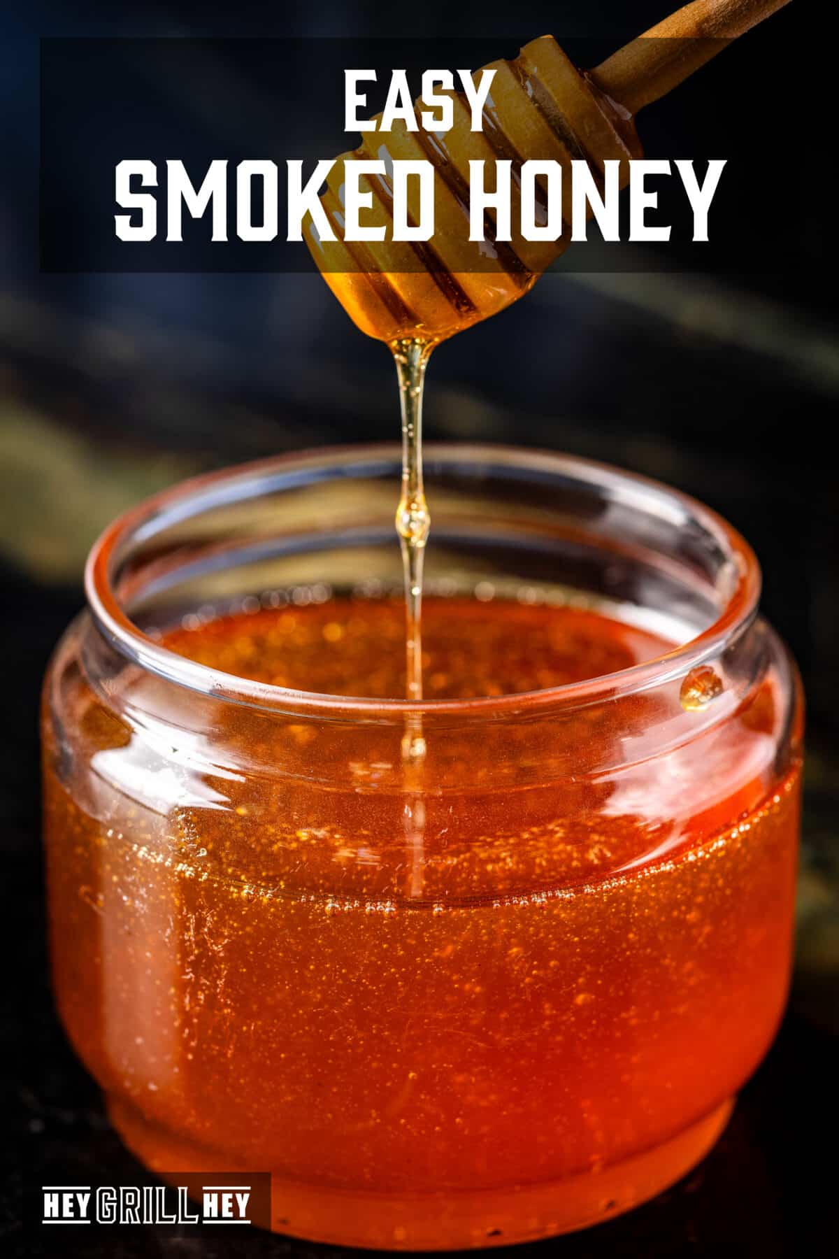 A honey comb that rains honey in a glass jar full of honey. The overlap of the text reads "Easy smoked honey" above, e "Hey Grill Hey" in conclusion.